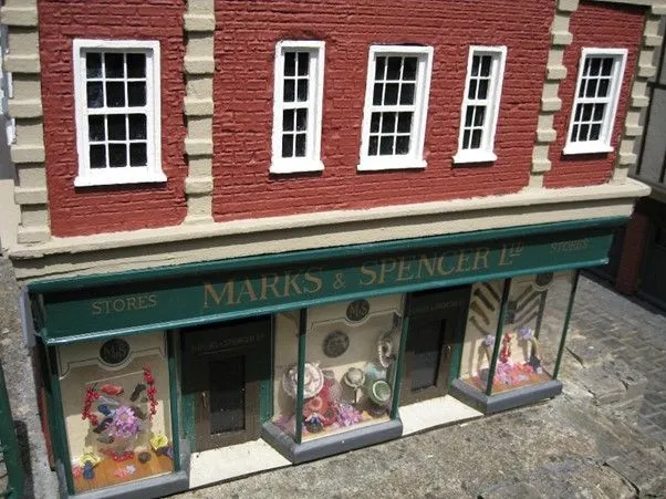 Miniature model of an old-style Marks & Spencer Ltd shopfront with decorated display windows